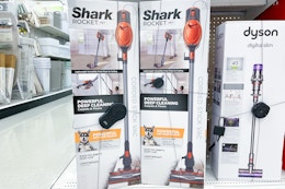 shark vacuums sitting on a target shelf