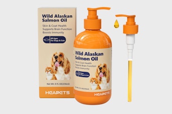 an orange bottle of wild Alaskan salmon oil and a bottle pump