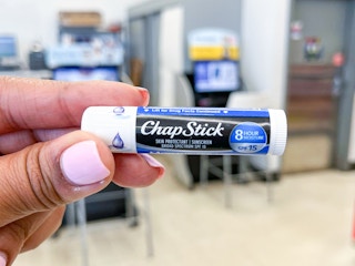 hand holding tube of chapstick
