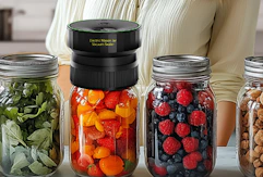 a mason jar sealer on jar full of fruit next to more jars