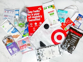 a target baby registry welcome bag with the contents layed out on a counter