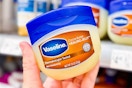 hand holding vaseline healing jelly in walmart aisle