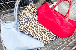 no boundaries tote bags in a cart