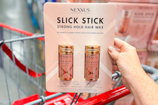 hand holding a pack of nexxus slick sticks