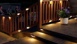 solar deck lights on a porch railing 