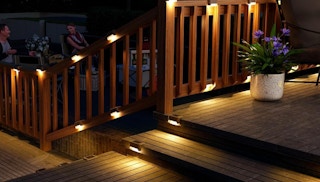 solar deck lights on a porch railing 