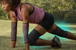 A woman using compression knee braces while working out
