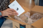 airtags coming out of an amazon box 