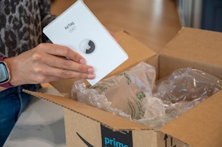 airtags coming out of an amazon box