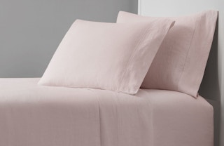 soft pink linen sheets on a bed