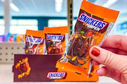 hand holding snickers pumpkins