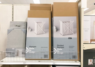 boxes of laundry hampers on store shelf