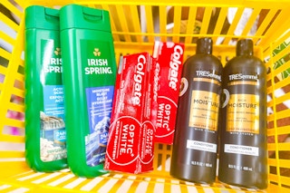 irish spring, colgate, tresemme products in a yellow basket