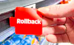 hand holding a red Walmart Rollbacks tag
