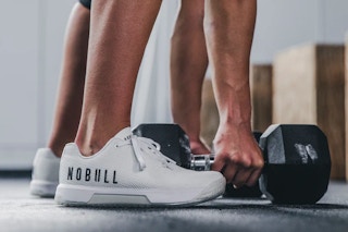 someone lifting weights in the gym wearing Nobull Crossfit Shoes