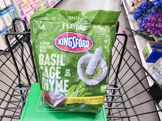 bag of kingsford flavors charcoal in a cart