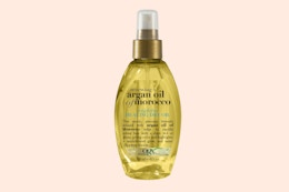 a bottle of hair oil spray