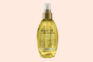 a bottle of hair oil spray