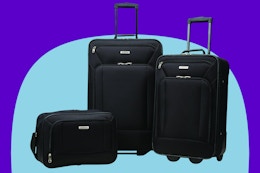  American Tourister Fieldbrook XLT Softside Upright Luggage on a blue background.
