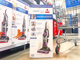 bissell powerforce vacuum on floor next to walmart cart