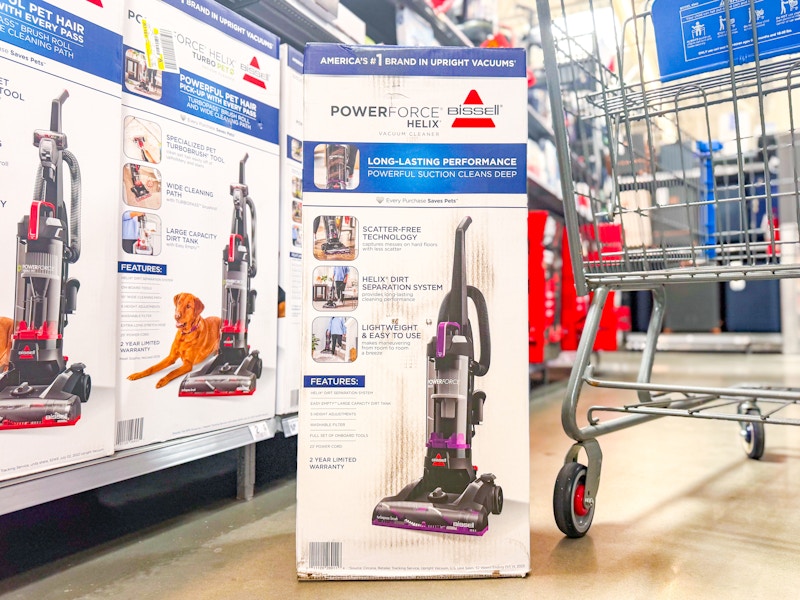 bissell powerforce vacuum on floor next to walmart cart