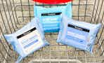 three packs of neutrogena makeup wipes in a shopping cart