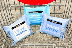 three packs of neutrogena makeup wipes in a shopping cart