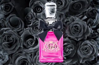 Juicy Couture Perfume in a pink bottle with black roses in the background