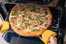 Someone baking a Papa Murphy's pizza in their oven