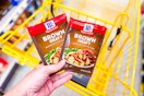 hand holding mccormick gravy at dollar general