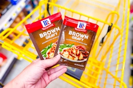 hand holding mccormick gravy at dollar general