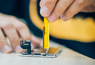 a person using a yellow pen tool