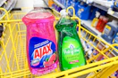 ajax and palmolive dish soap in a yellow shopping cart