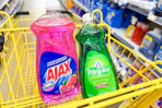 ajax and palmolive dish soap in a yellow shopping cart