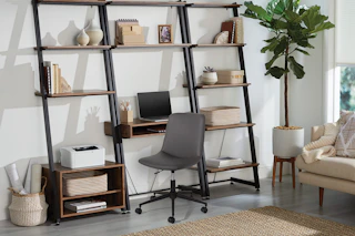 stock image of a gray office chair in front of a desk