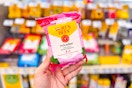 person holding a package of burts bees micellar wipes