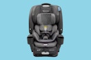 A Graco 5-in-1 car seat on a blue background. 
