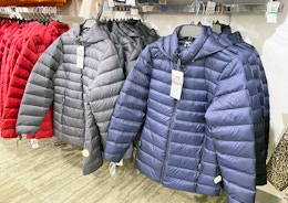 display of puffer coats in store at Macy's