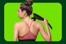 a woman using a body massager