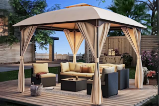 Lifestyle image of Lausaint Gazebo set up outdoors with patio furniture 