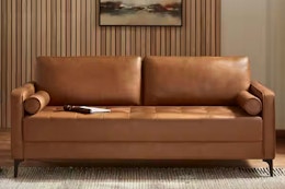 Lifestyle image of the Stylewell Mid-Century (faux leather) sofa in living room setting