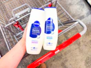 hand holding nivea dermacomfort body washes in cvs