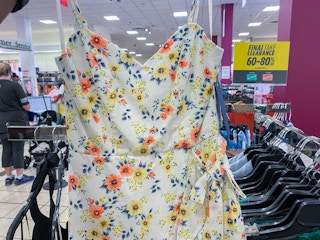 hand holding women's clearance dress