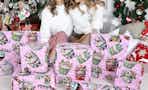 women near wrapped christmas boxes