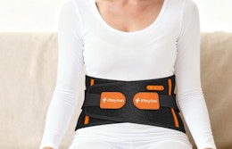 a person with a cordless heating pad around their waist