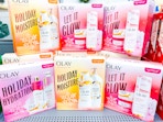 Olay Holiday Gift Sets stacked on top of one another at Walmart