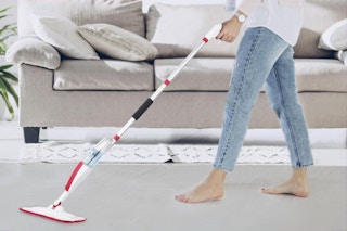 woman pushing mop set on floor
