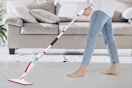 woman pushing mop set on floor