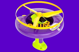a bubble launcher toy on a purple background