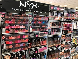 hand holding two nyx lip liners